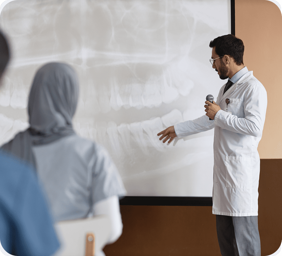 Doctor explaining X-ray image in lecture.